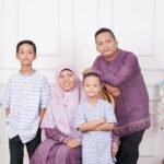 A family poses together for a group photo.